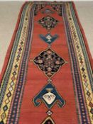 PERSIAN WOOL RUNNER, multicoloured and multibordered with floral and shaped patterns throughout, 620