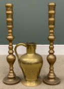 PAIR OF TALL BRASS CANDLESTICKS, 74cms (h) and a brass ewer/jug, 39cms (h) Provenance: private