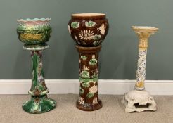 THREE POTTERY PLANTERS WITH STANDS including two majolica, 90cms the tallest and a continental