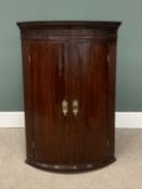 VICTORIAN MAHOGANY BOW FRONTED WALL HANGING CORNER CUPBOARD, with two doors and dentil type cornice,