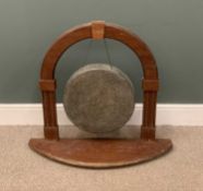 LARGE DINNER GONG suspended from a lunette mahogany stand, 84 (h) x 91 (w) x 25cms (d) Provenance: