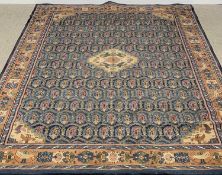 PERSIAN WOOLLEN RUG of blue ground with central diamond and bird pattern to the border, 330 x 237cms