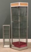 TWO MODERN RETAILSHOWCASES of hexagonal form with four circular revolving glass shelves and lockable