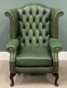 BUTTONED LEATHER WING BACK ARMCHAIR in racing green, 109 (h) x 90 (w) x 54cms (d) Provenance: