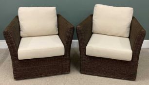 MODERN PAIR OF GARDEN ARMCHAIRS in rattan/wicker effect, upholstered cushions Provenance: private