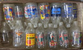 COLLECTION OF VINTAGE MILK BOTTLES with colourful advertising slogans for Cornflakes, Coco Pops,