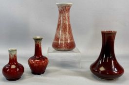 FOUR COBRIDGE STONEWARE VASES, red mottle glazed with impressed marks, 22cms (h) the tallest