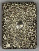 EDWARDIAN RECTANGULAR SILVER PURSE with repousse scroll floral and leaf decoration, green silk lined