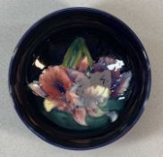 MOORCROFT ORCHID PATTERN CIRCULAR FOOTED BOWL, impressed marks, 6 (h) x 13cms (diam.) Provenance: