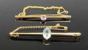 15CT GOLD & AQUAMARINE BAR BROOCH with safety chain and a 9ct gold and amethyst bar brooch with