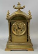 FRENCH GILT BRASS CARRIAGE CLOCK, late 19th century, the arched top surmounted with central urn