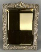 ART NOUVEAU SILVER FACED TOILET MIRROR, stylised floral embossed decoration, bevelled plate with