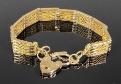 9CT GOLD GATE BRACELET with heart shaped padlock and safety chain, 21.5gms Provenance: private
