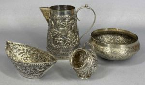 INDIAN WHITE METAL GROUP comprising a jug with loop handle, the body chased with figures and