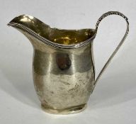 SILVER CREAM JUG of plain oval form, acanthus capped loop handle, hallmark rubbed, 9cms (h), 2oz