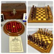 WOODEN GAMES BOARDS comprising inlaid and carved chess board and chess pieces, 45cms², a solitaire