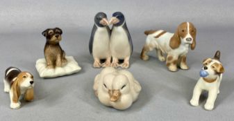 SIX SMALL ROYAL COPENHAGEN ANIMAL FIGURES comprising basset puppy, terrier on cushion, spaniel,