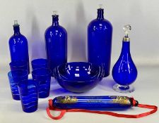 THREE BRISTOL BLUE GLASS CHEMISTS' BOTTLES WITH STOPPERS, 41cms (h) the tallest, circular fruit