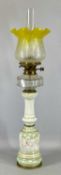 A VICTORIAN OIL LAMP having slender lustre glazed ceramic column, faceted clear cut glass reservoir,