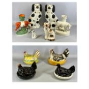 GROUP OF 19TH CENTURY STAFFORDSHIRE ORNAMENTS including pair of large black and white seated
