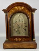 EDWARDIAN INLAID MAHOGANY DOME TOP MANTEL CLOCK, turned columns flanking an arched glazed door