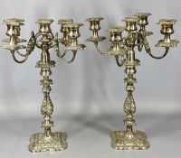 PAIR OF PLATED FOUR BRANCH CANDELABRAS with centre sconces, removable nozzles and repousse