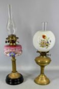 TWO VICTORIAN OIL LAMPS, one having black ceramic base, brass column, painted opaque glass reservoir