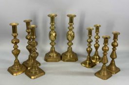 PAIR OF 'KING OF DIAMONDS' BRASS CANDLESTICKS, 31cms (h) along with a trio and two pairs of