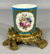 SERVES PORCELAIN VASE circa 1850, of cylindrical form, painted in polychrome enamels, flowers within