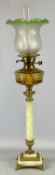 OIL LAMP having an alabaster gilt metal base and column, amber glass reservoir with twin burners,