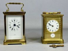 GILT BRASS CASED CARRIAGE CLOCK, having circular enamel dial with Roman numerals, subsidiary alarm