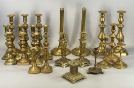 LARGE COLLECTION OF ANTIQUE BRASS CANDLESTICKS, singles and pairs, 33cms (h) the tallest Provenance: