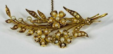 VICTORIAN 15CT GOLD BROOCH, flower and leaf design, set with split seed pearls with safety chain,