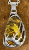 CATHERINA R.M. CONTEMPORARY DESIGN STERLING SILVER & AMBER ASYMMETRIC PENDANT, approx. 60 x 30mm