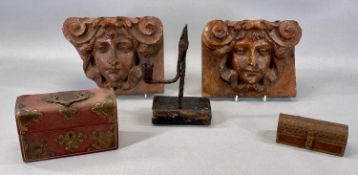 PAIR OF VICTORIAN TERRACOTTA MASK HEAD WALL BRACKETS, 18 x 23cms, wrought iron rushlight holder on