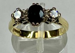 18CT GOLD RING SET WITH CENTRAL SAPPHIRE, flanked with diamond to either side, sapphire approx. 1ct,