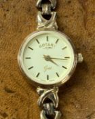 ROTARY ‘GOLD’ 9CT GOLD LADIES’ WRISTWATCH & BRACELET with circular case, champagne dial, baton