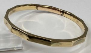 9CT GOLD BANGLE, twelve sided, 9cms (w), 14.3gms Provenance: private collection Denbighshire