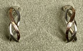 PAIR OF CLOGAU WHITE & ROSE GOLD CUFF EARRINGS of Celtic twist design, in original box Provenance: