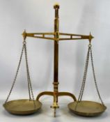 PAIR OF BRASS BEAM SCALES (DeGrave & Co., London) with twin pans, 60.5cms (h) Provenance: private
