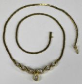 9CT GOLD FLEXIBLE LINK NECKLACE set with seven small diamonds, 40cms (l), 10.3gms Provenance: