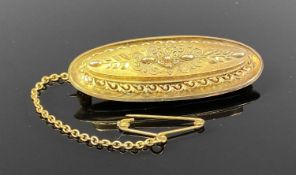 VICTORIAN 15CT GOLD OVAL BROOCH with safety chain, 5.8gms Provenance: private collection Conwy