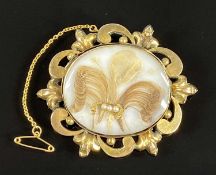 VICTORIAN MOURNING BROOCH having hair and seed pearls, in ornate, possibly 9ct gold, mount with