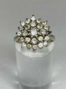 18CT WHITE GOLD DIAMOND CLUSTER RING, size O, 5.7gms Provenance: deceased estate Conwy