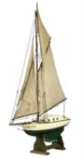 VINTAGE WOODEN POND YACHT with green and cream painted hole, fully rigged, 114cms (h) included stand