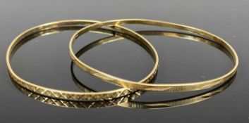 TWO 9CT GOLD OVAL BANGLES, approx 70 x 60mm, 11.2gms Provenance: deceased estate Conwy