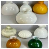 ASSORTMENT OF NINE OPAQUE GLASS OIL LAMP SHADES, 39cms (diam.) the largest Provenance: private