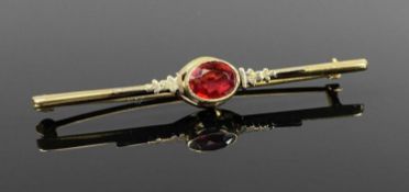 VINTAGE GOLD BAR BROOCH set with oval garnet, marked '10k', 2.5gms Provenance: private collection
