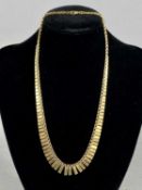 9CT GOLD CLEOPATRA FRINGE COLLAR NECKLACE having plain links, 39.5cms (l), 6.8gms Provenance: