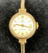 CYMAFLEX LADY'S 9CT GOLD BRACELET WATCH, circular case, silvered dial having Arabic and baton hour